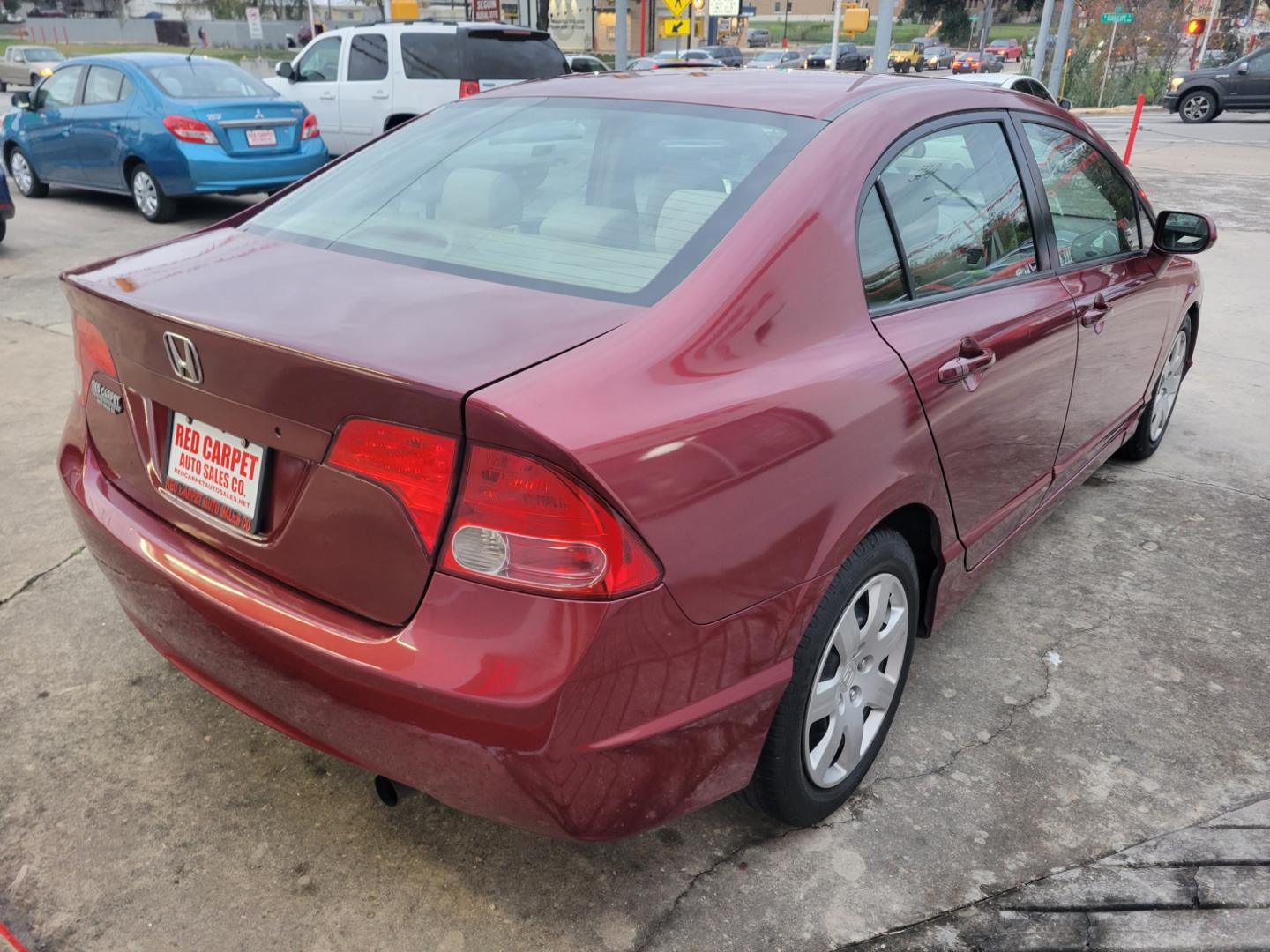 2007 Red Honda Civic (2HGFA16587H) with an 1.8L I4 F SOHC 16V engine, Automatic transmission, located at 503 West Court, Seguin, TX, 78155, (830) 379-3373, 29.568621, -97.969803 - Photo#2